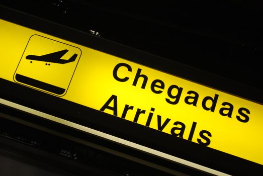 yellow arrivals sign at a international airport