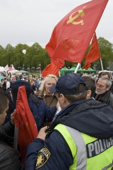 RIGA, LATVIA, MAY 9, 2009: The Police preclude to use the forbidden symbols of Soviet Union at Celebration of May 9 Victory Day (Eastern Europe) in Riga at Victory Memorial to Soviet Army