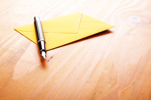 mail or email concept with envelope and pen