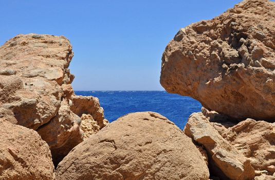 The red sea in Egypt seen through some rocks.