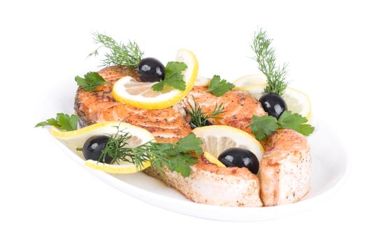 Appetizing Grilled Salmon with lemon, black olives and mixed greens