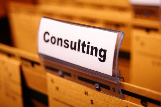 consulting word on business office folder rider showing financial success concept