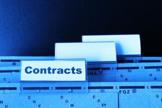 contract word on business folder showing trade or financial concept