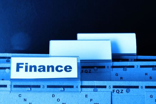 finance on business office folder showing financial success concept
