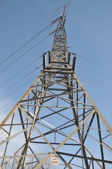 electric tower with warning sign