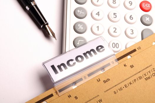 income word on business folder showing finance financial or earnings concept