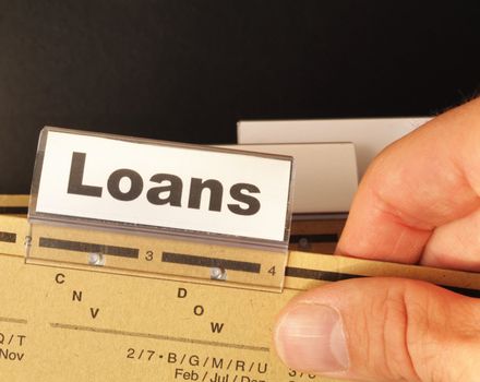 loan application in business folder showing financial investment concept