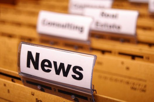 news or newsletter concept with word on folder register in business office