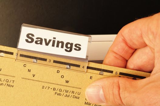 savings word on business folder showing saving money concept