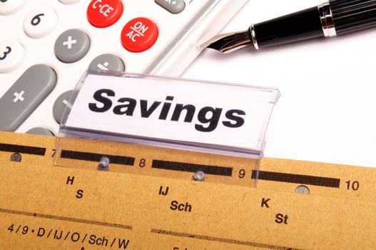 savings word on business folder showing saving money concept