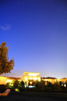 night sky with stars over the town or city and copyspace