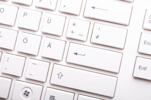 modern computer keyboard on white showing pc or technology concept