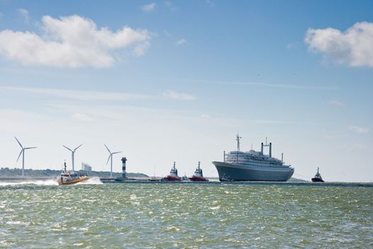 HOEK VAN HOLLAND -THE NETHERLANDS-AUGUST 2008-Pulled by tugs, retired HAL�s SS Rotterdam comes in on her last voyage to her homeport Rotterdam. August 04, 2008, Hoek van Holland, The Netherlands