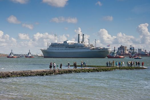 HOEK VAN HOLLAND -THE NETHERLANDS-AUGUST 2008-Pulled by tugs, retired HAL�s SS Rotterdam comes in on her last voyage to her homeport Rotterdam. August 04, 2008, Hoek van Holland, The Netherlands