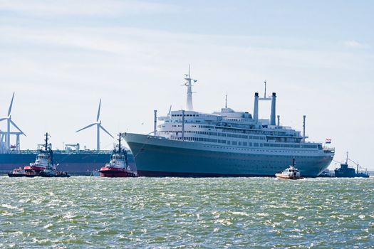 HOEK VAN HOLLAND -THE NETHERLANDS-AUGUST 2008-Pulled by tugs, retired HAL�s SS Rotterdam comes in on her last voyage to her homeport Rotterdam. August 04, 2008, Hoek van Holland, The Netherlands