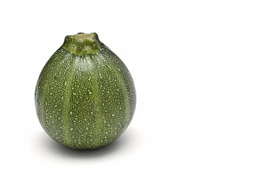 Round zucchini isolated on a white background.