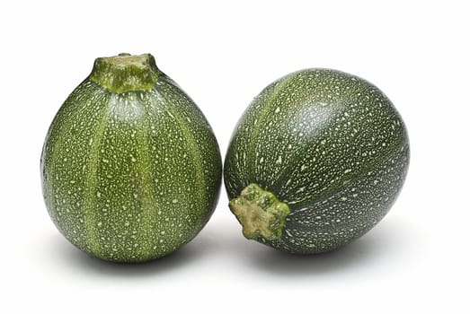 Round zucchini isolated on a white background.