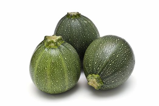 Round zucchini isolated on a white background.