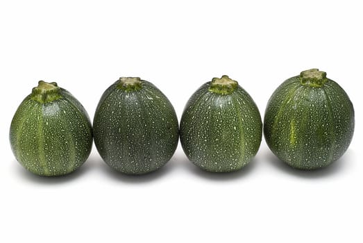 Round zucchini isolated on a white background.