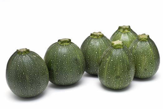 Round zucchini isolated on a white background.