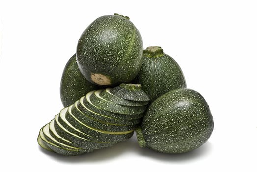 Round zucchini isolated on a white background.