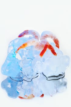 Shrimps frozen in ice cube, isolated on white background