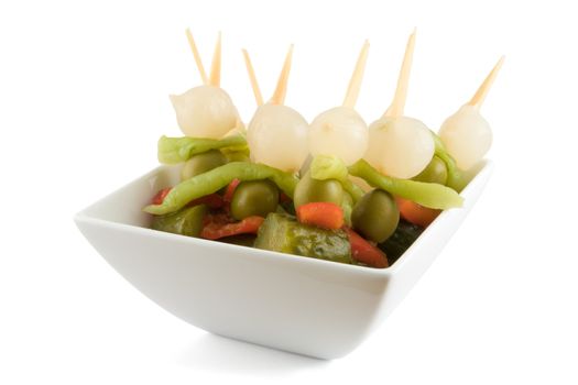 Wooden Sticks with exotic vegetables on a white background