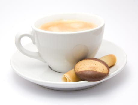 Cup of cofee on a saucer with some cookies