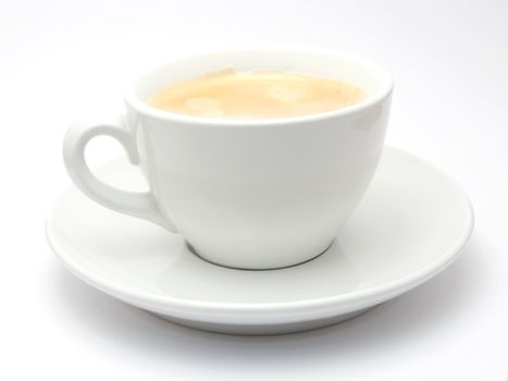 A cup of coffee with foam isolated on a white background