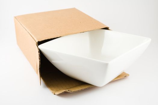 Dish in Cardboard Box isolated on a white background