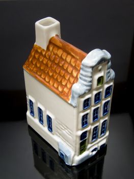Dutch House on a black background with reflection