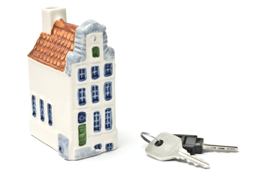 House and keys isolated over white background