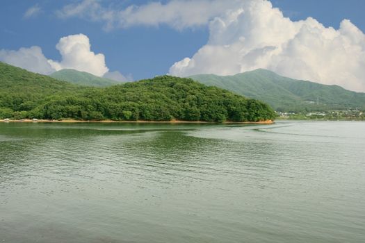 Lake Gwacheon in Anyang Korea - lake mountain and cloudscape