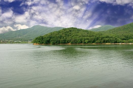 Lake Gwacheon in Anyang Korea - lake mountain and sunbeam