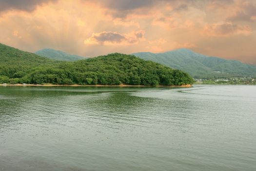 Lake Gwacheon in Anyang Korea - lake mountain and sunbeam