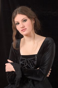 Beautiful young girl with gothic makeup and clothing