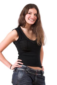 Beautiful teenager standing in a confident pose with her hands on her hip and smiling