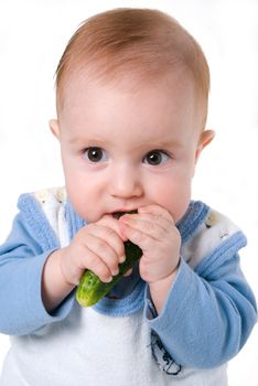 tot and cucumber,small boy eats fresh cucumber