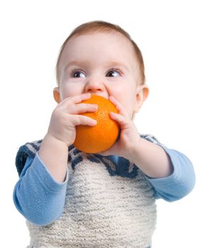 Rustic child eats present orange.The Useful fruit. Vitamins