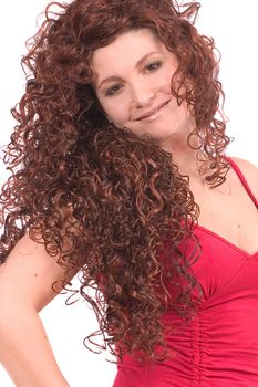 Beautiful smiling woman with red long curly wig