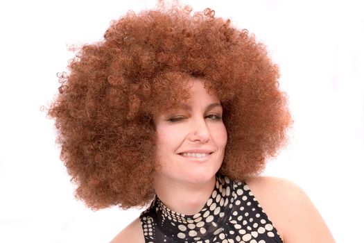 Pretty woman with red afro wig winking