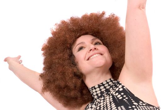 Lovely young woman stretching her arms out above her head in a gesture of happiness