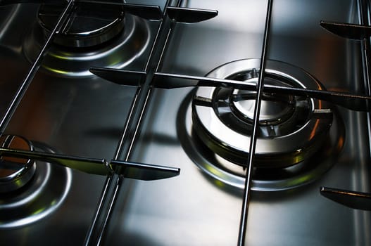 Metal gas cooker on modern kitchen