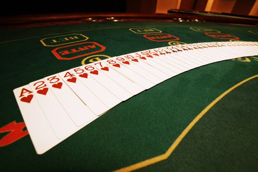 Playing cards on a game table in a casino