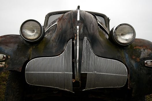 The old car under the autumn sky