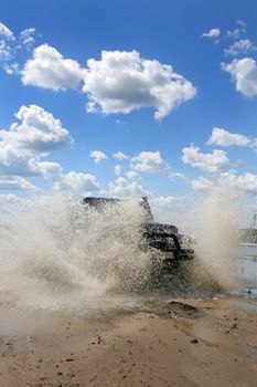 The sports car moving a water barrier