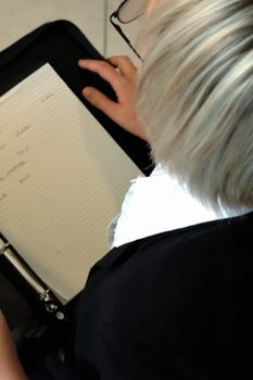 business woman reading notes