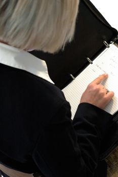 business woman reading notes