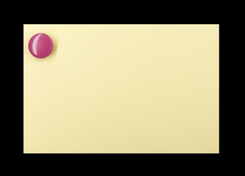 Purple pushpin holding up a yellow note on a black background