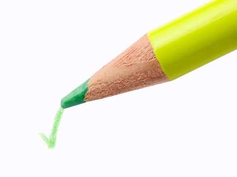 Closeup of a Pencil and checkmark isolated on a white background